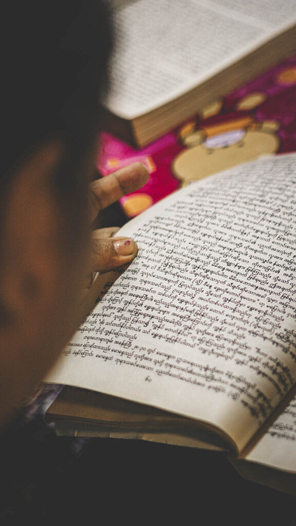 ABC Bible and Leadership Curriculum student studying biblical material in Myanmar.