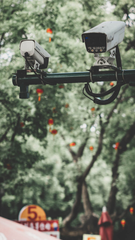 Security surveillance cameras near the Forbidden City in Beijing, China.