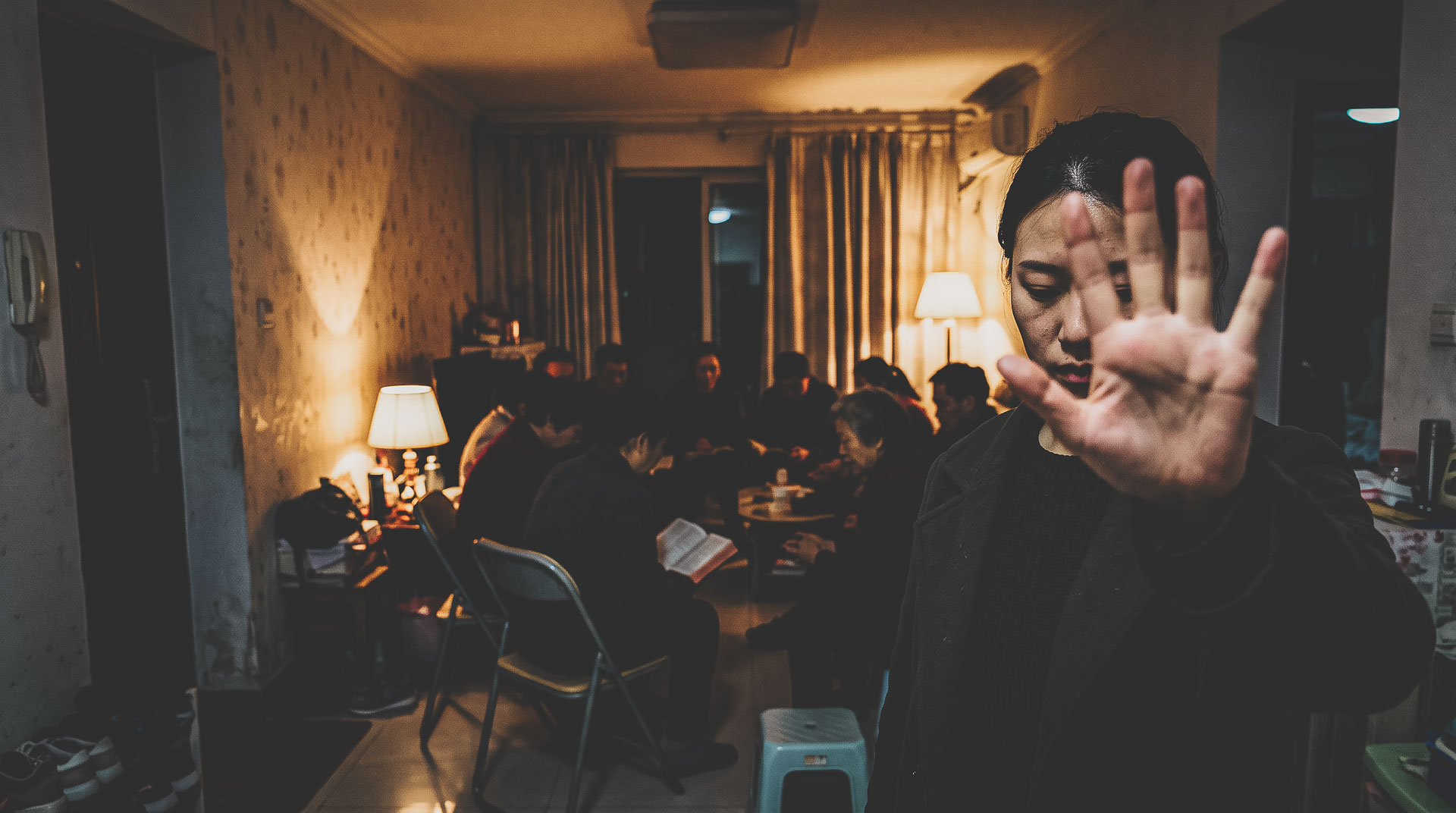 Illustration of Chinese Christians gathering for Bible study in a private home.