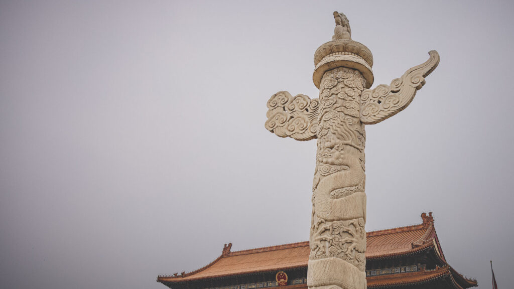 Ornate stone dragon column at Tiananmen Square in Beijing, China.