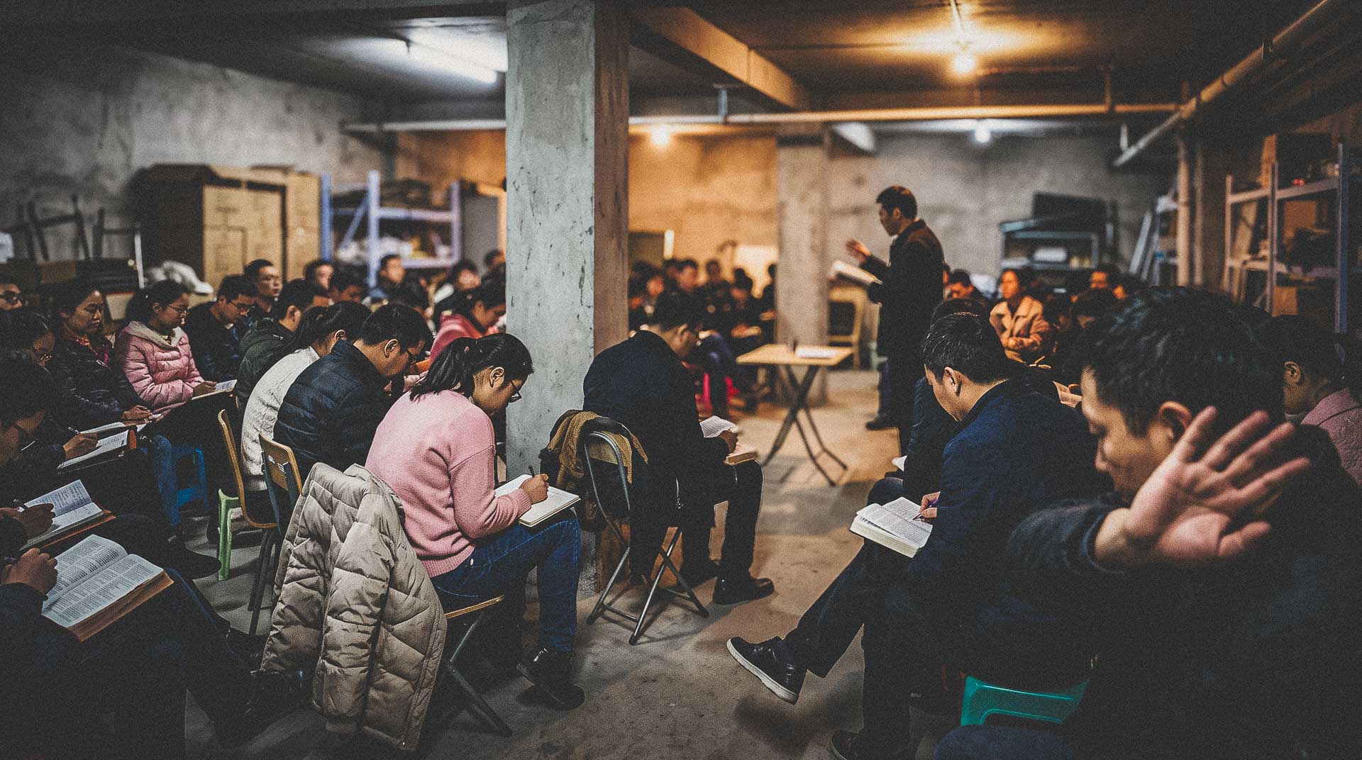 Chinese Christians studying the Bible during a house church gathering in China