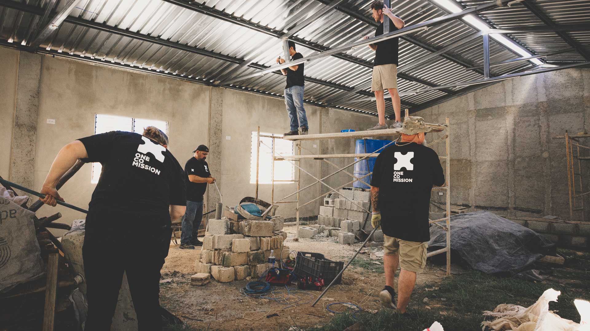 OneCoMission team members helping with a church construction project in Cuba.