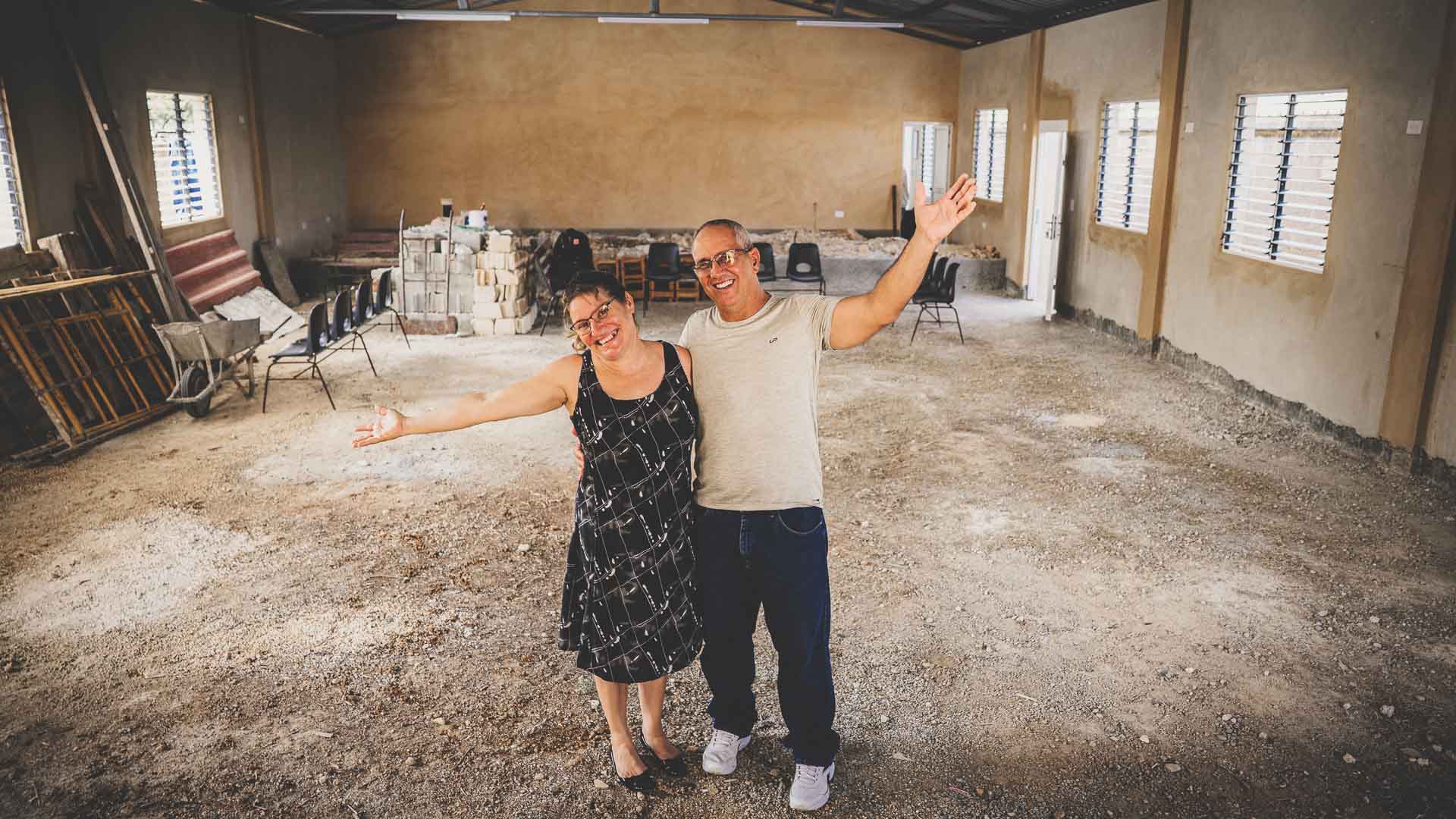 Local church planters celebrating inside their unfinished church building in Cuba.