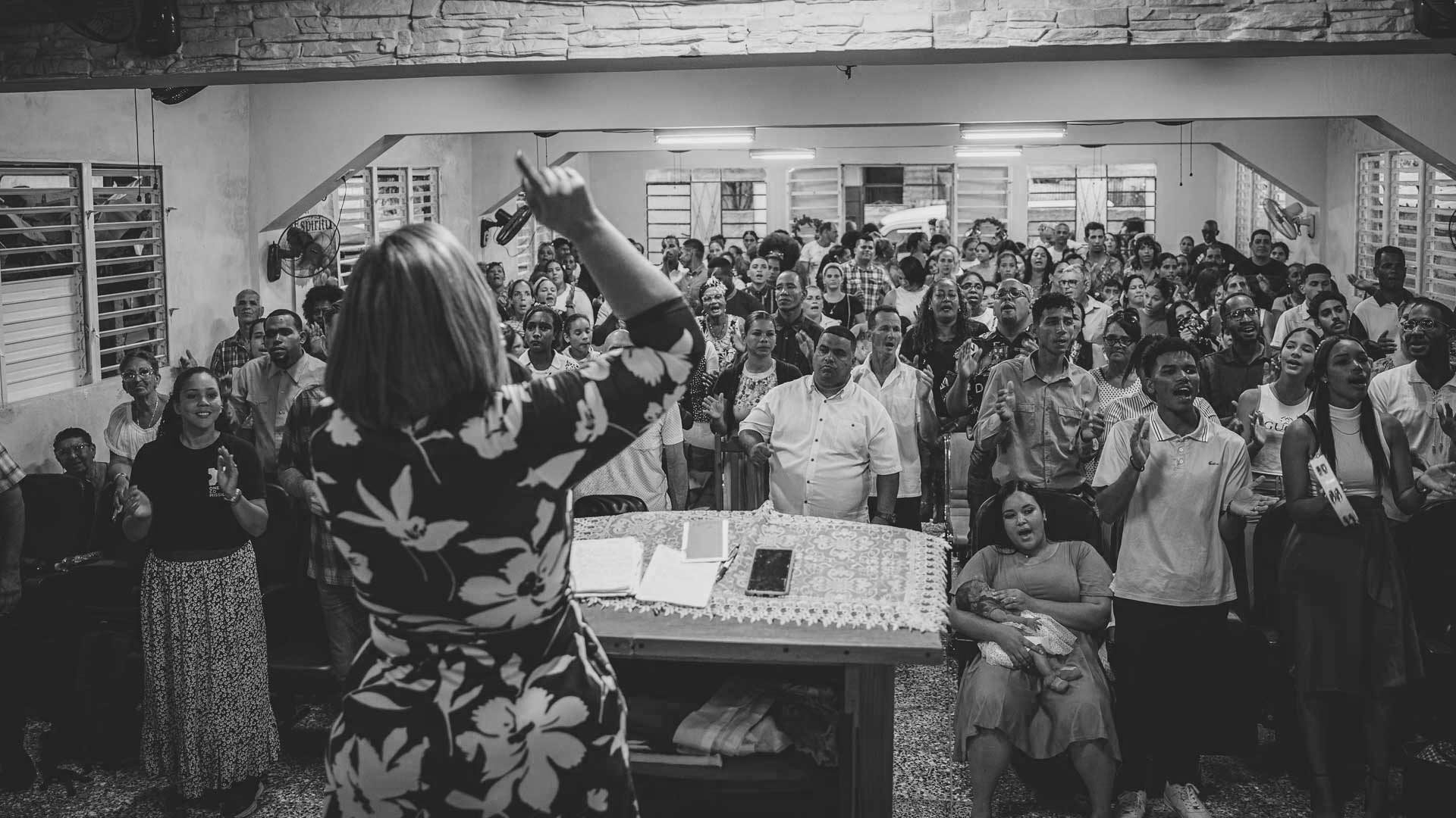 Christians worship together during a crowded church service in Cuba.