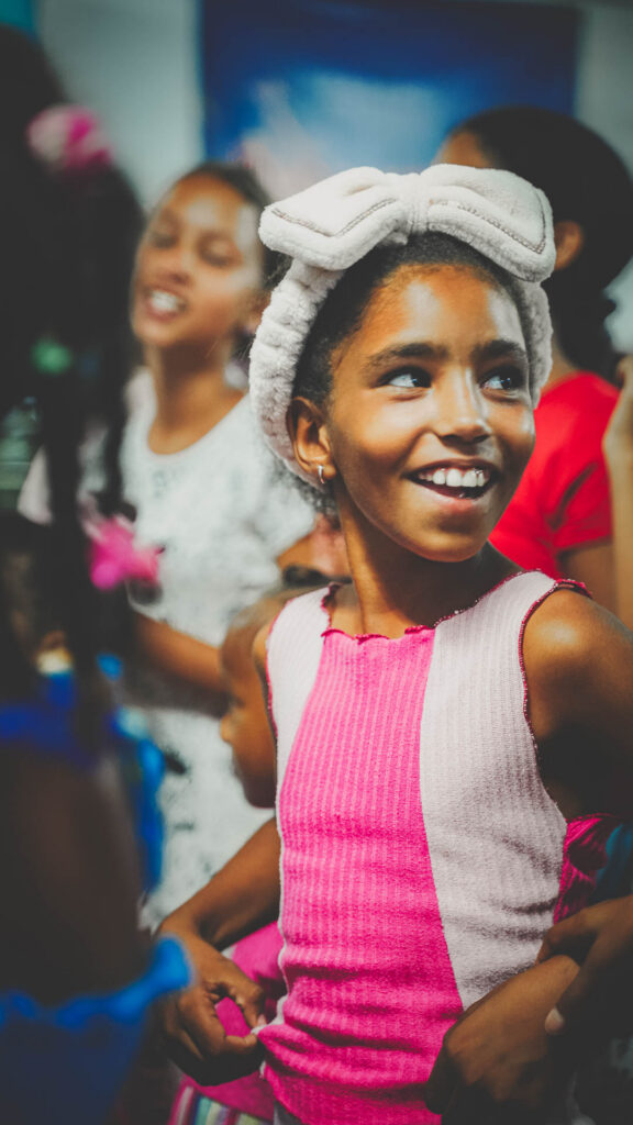 Young girl smiling during a children’s ministry gathering at a local church in Cuba.