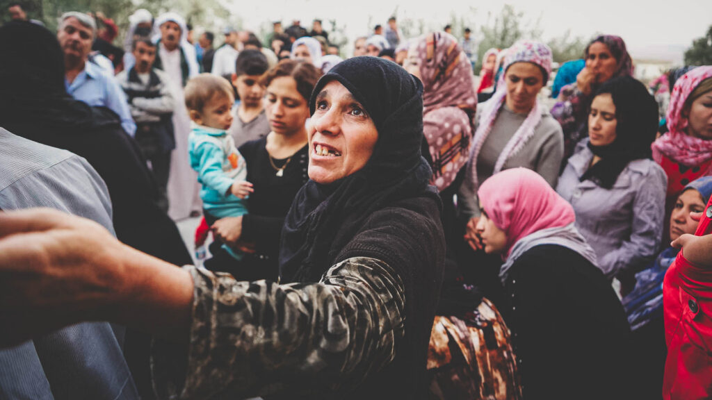 Woman among families gathered for a compassion evangelism outreach in Kurdistan, Iraq.