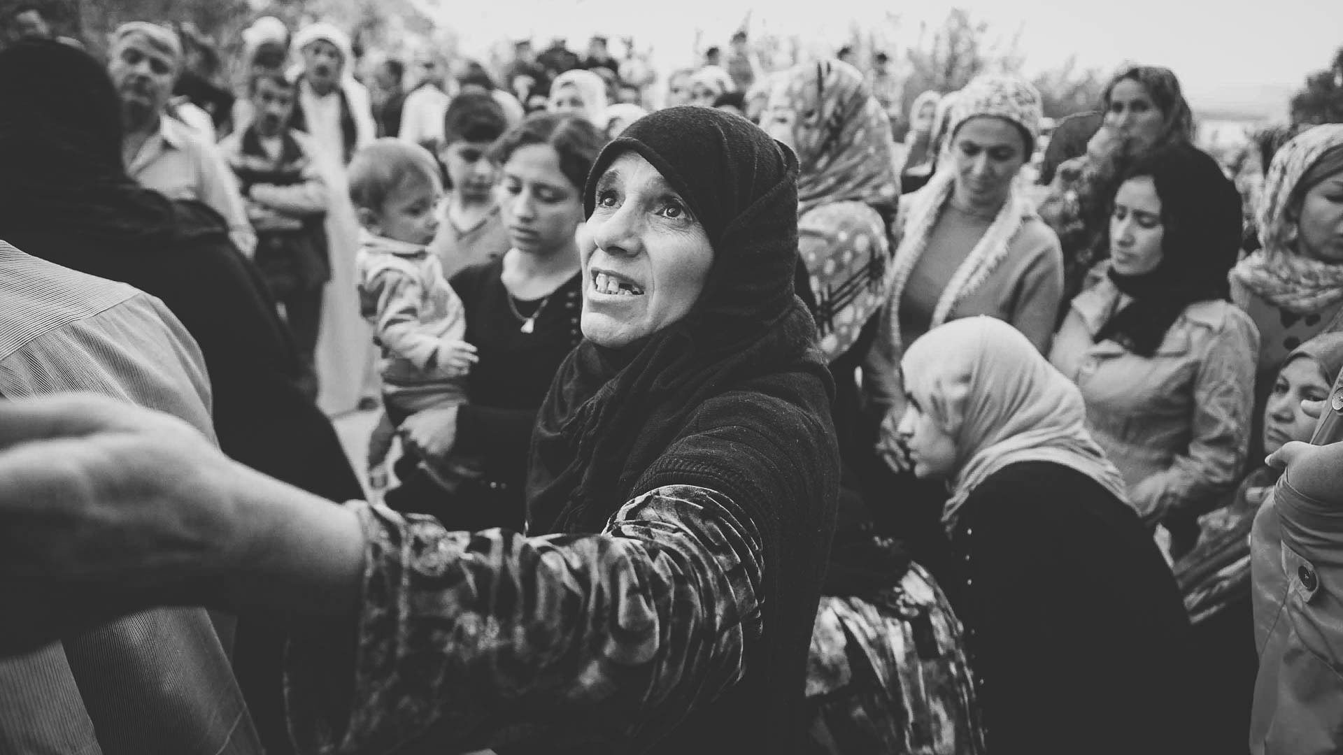 Woman among families gathered for a compassion evangelism outreach in Kurdistan, Iraq.