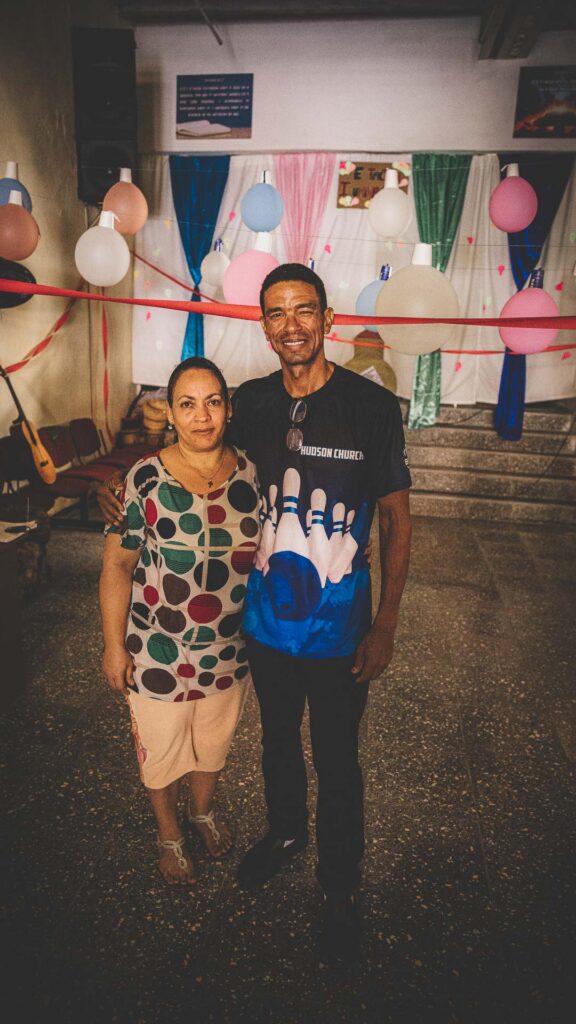 Two local pastors standing together inside a church in Havana, Cuba.