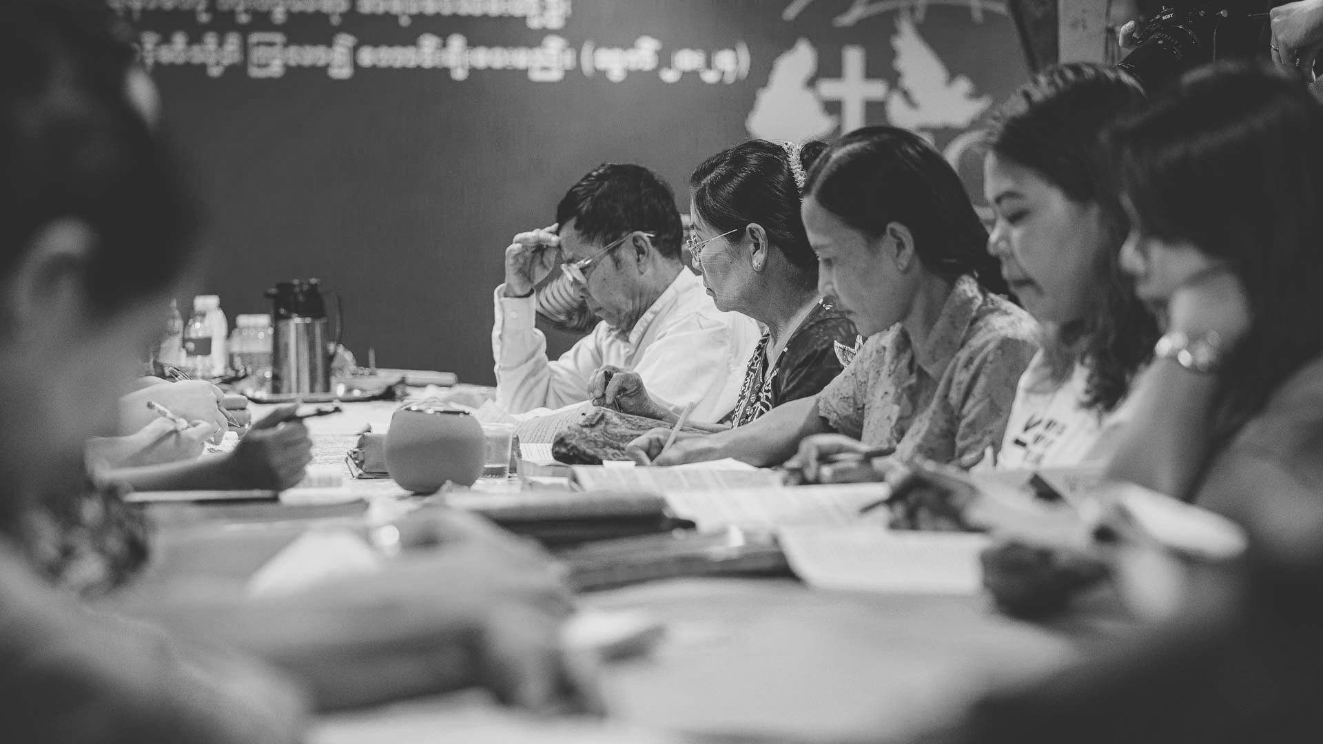 Christian leaders studying ABC curriculum together during Bible and leadership training in Myanmar.