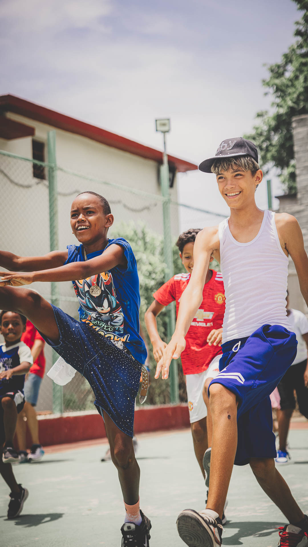 Young people participating in a sports ministry activity on a community court in Cuba.