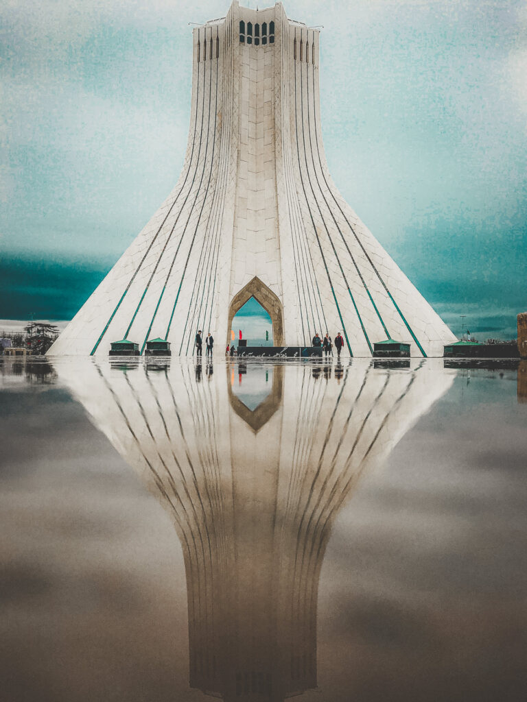 Azadi Tower reflected in water in Tehran, Iran.